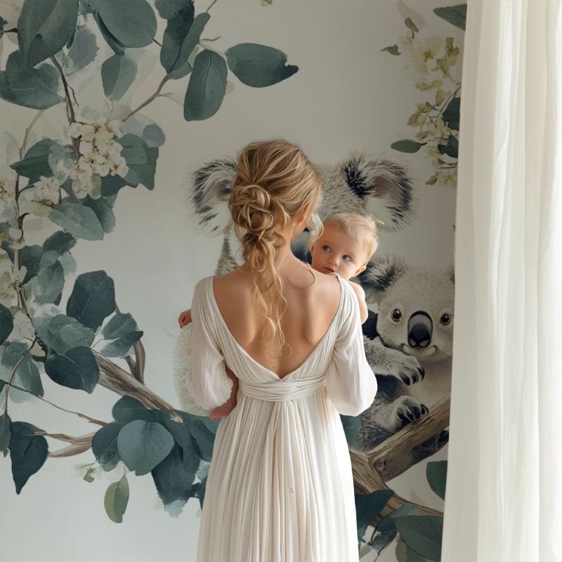 Koala eucalyptus wallpaper creating a calm reading nook in a playroom