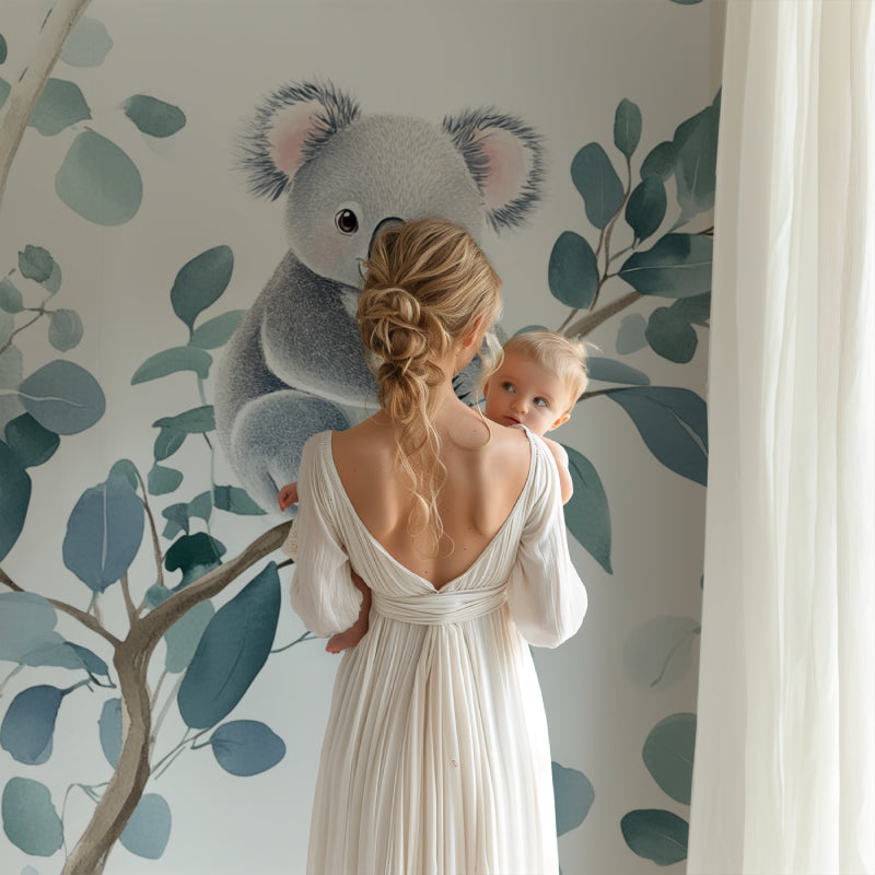 Koala wallpaper creating a peaceful atmosphere in a modern nursery with white furniture