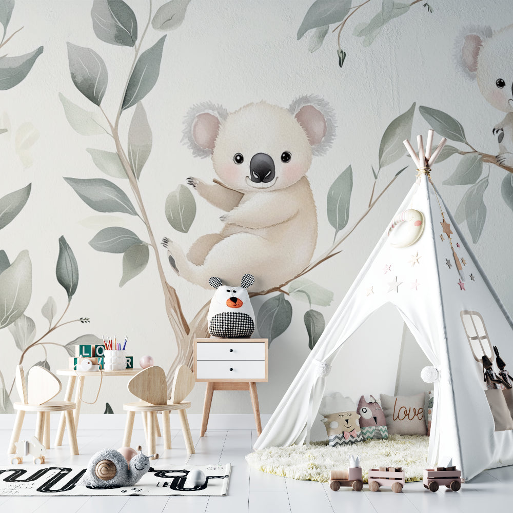 Nursery wall mural with koalas and clouds in a gender-neutral baby room