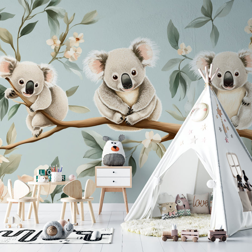 Nursery with koala mural wallpaper styled with matching sage green accessories