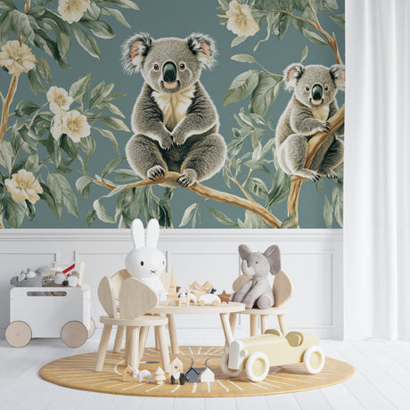 Koala wallpaper mural creating a peaceful atmosphere in a modern nursery with white furniture