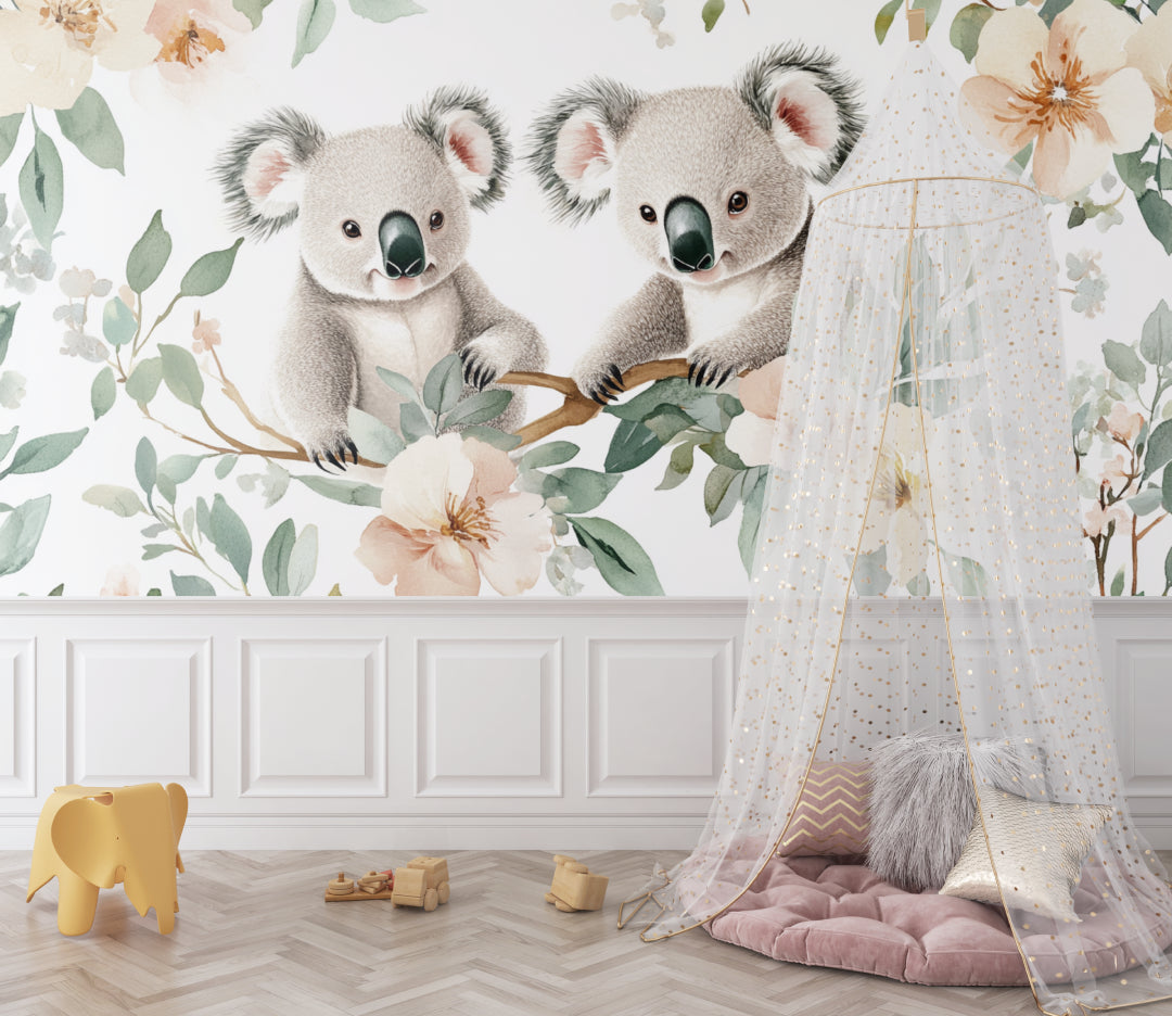 Koala nursery wallpaper in a modern white nursery with natural wood furniture and soft textiles