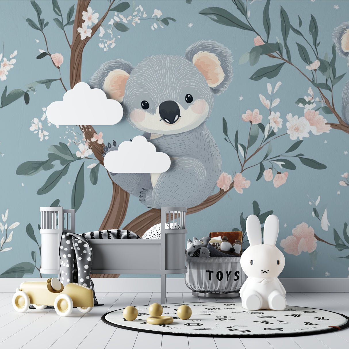 Koala nursery wallpaper mural styled in a modern baby room with white furniture