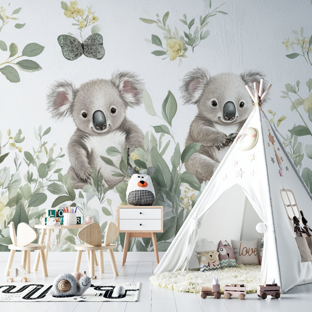 Sweet koala wall mural brightening up a child's reading nook with soft cushions and warm lighting