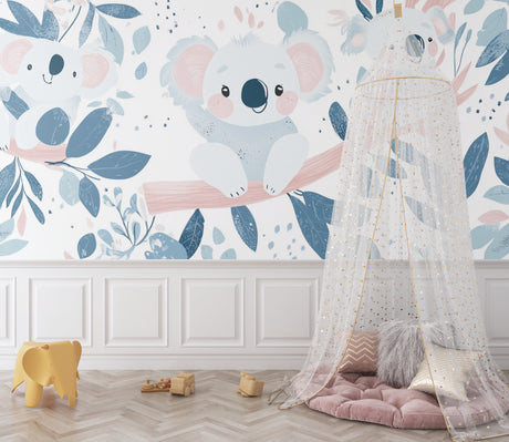 Koala nursery wallpaper creating a peaceful atmosphere in a modern white nursery with natural wood furniture