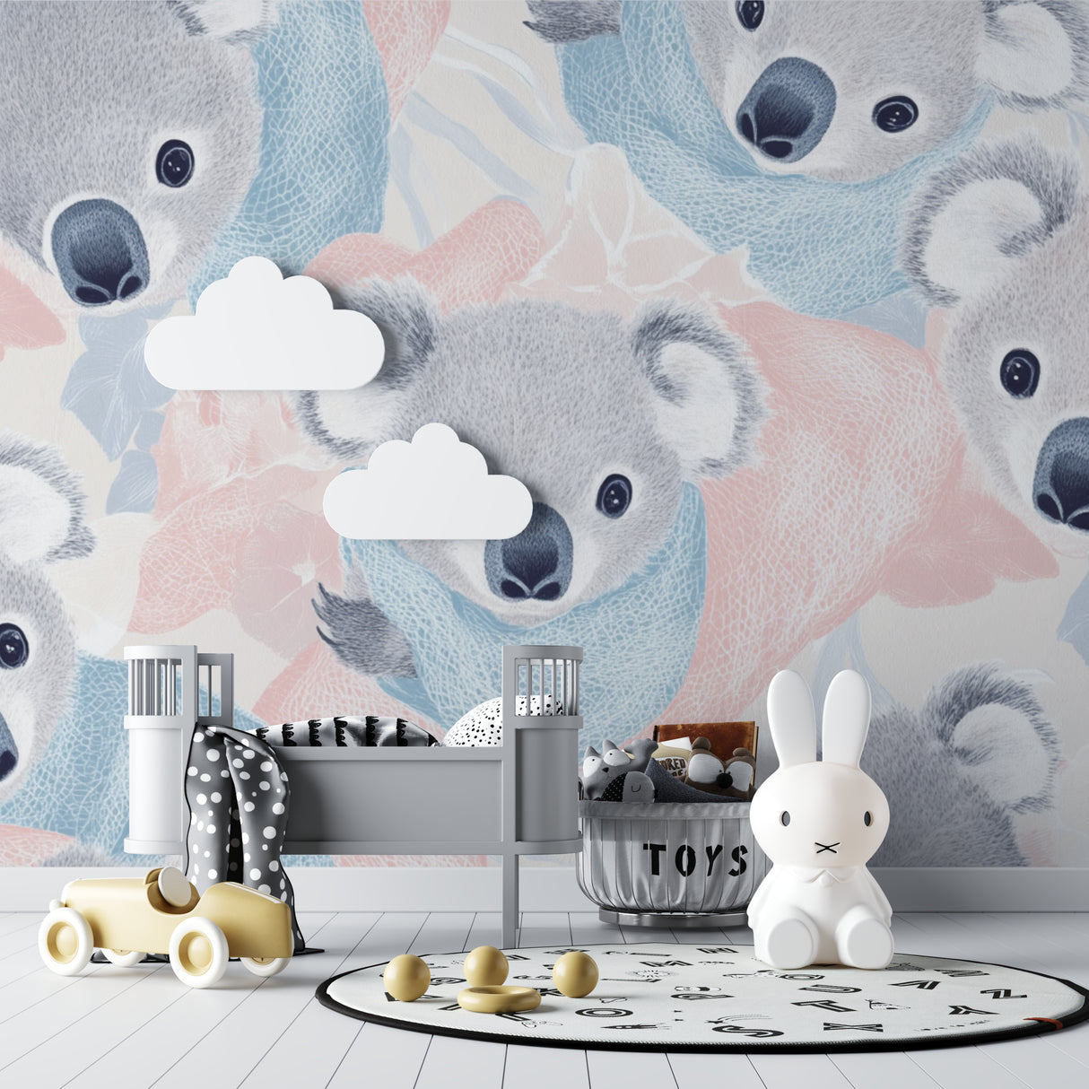 Koala nursery wallpaper in modern white nursery with wooden crib and rocking chair