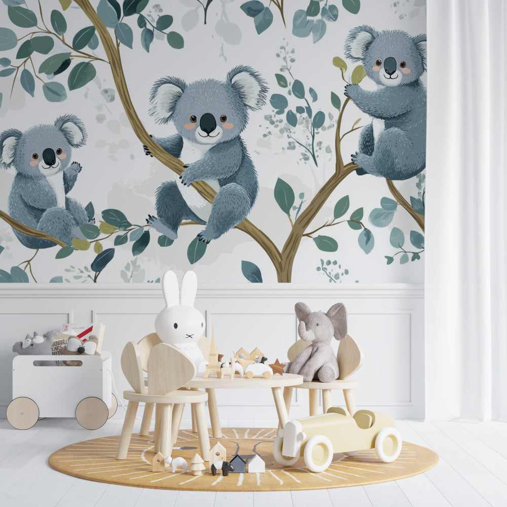 Koala wallpaper mural in a bright nursery with white furniture showing peaceful sleeping koalas