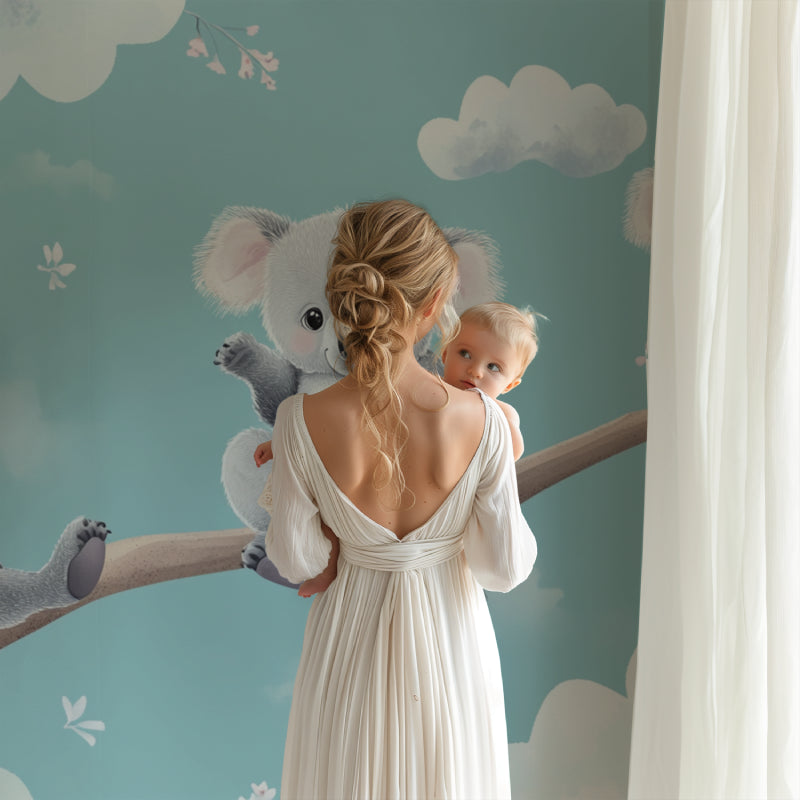 Kids bedroom featuring koala mural wallpaper with reading nook and playful accessories