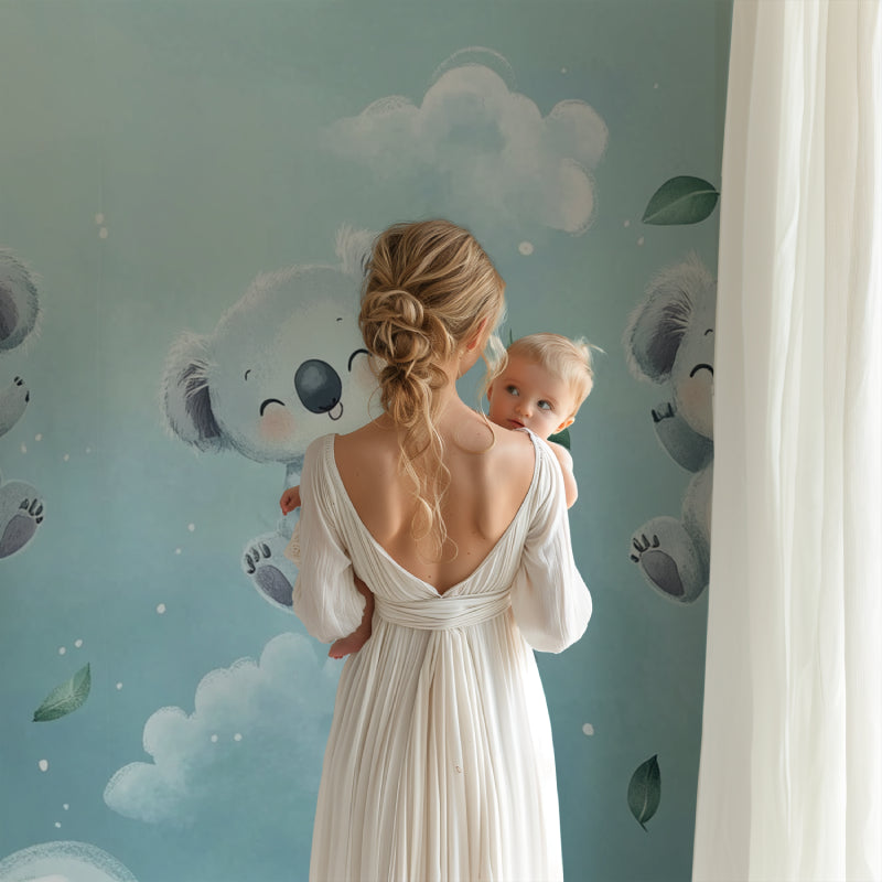 Koala nursery wallpaper creating a peaceful atmosphere in a modern baby room with white furniture