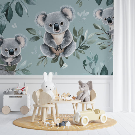 Koala nursery wallpaper in a bright modern nursery with white furniture and natural decor