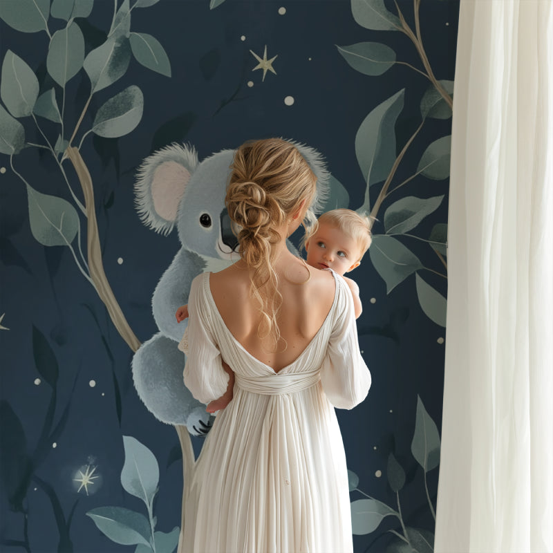 Koala nursery wallpaper creating a peaceful atmosphere in a modern nursery with white furniture