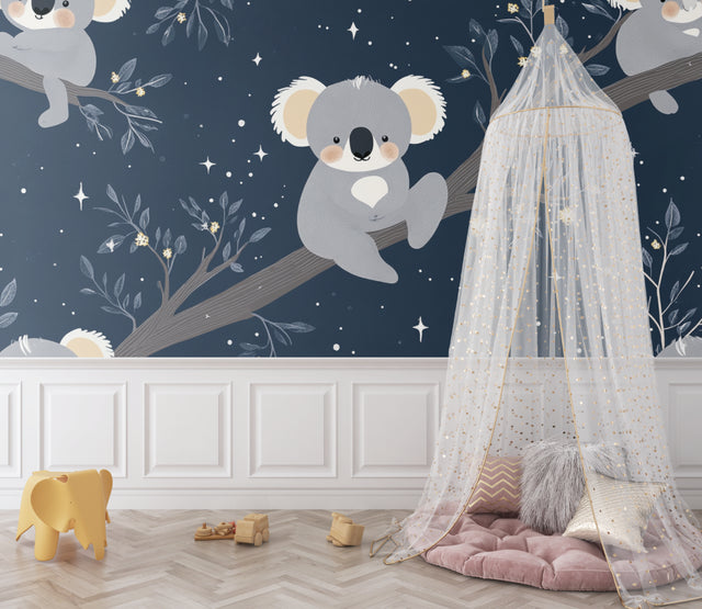 Koala nursery wallpaper in a modern white nursery, creating a peaceful sleeping environment with starry night design