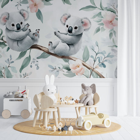Koala nursery wallpaper creating a peaceful atmosphere in a modern white nursery with natural wood furniture