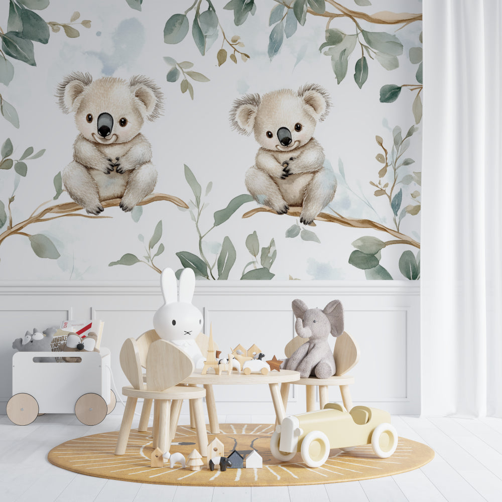 Koala wallpaper mural creating a peaceful atmosphere in a bright nursery with white furniture