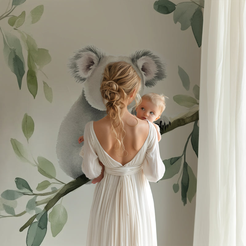 Eucalyptus and koala wallpaper brightening a baby's room with natural light