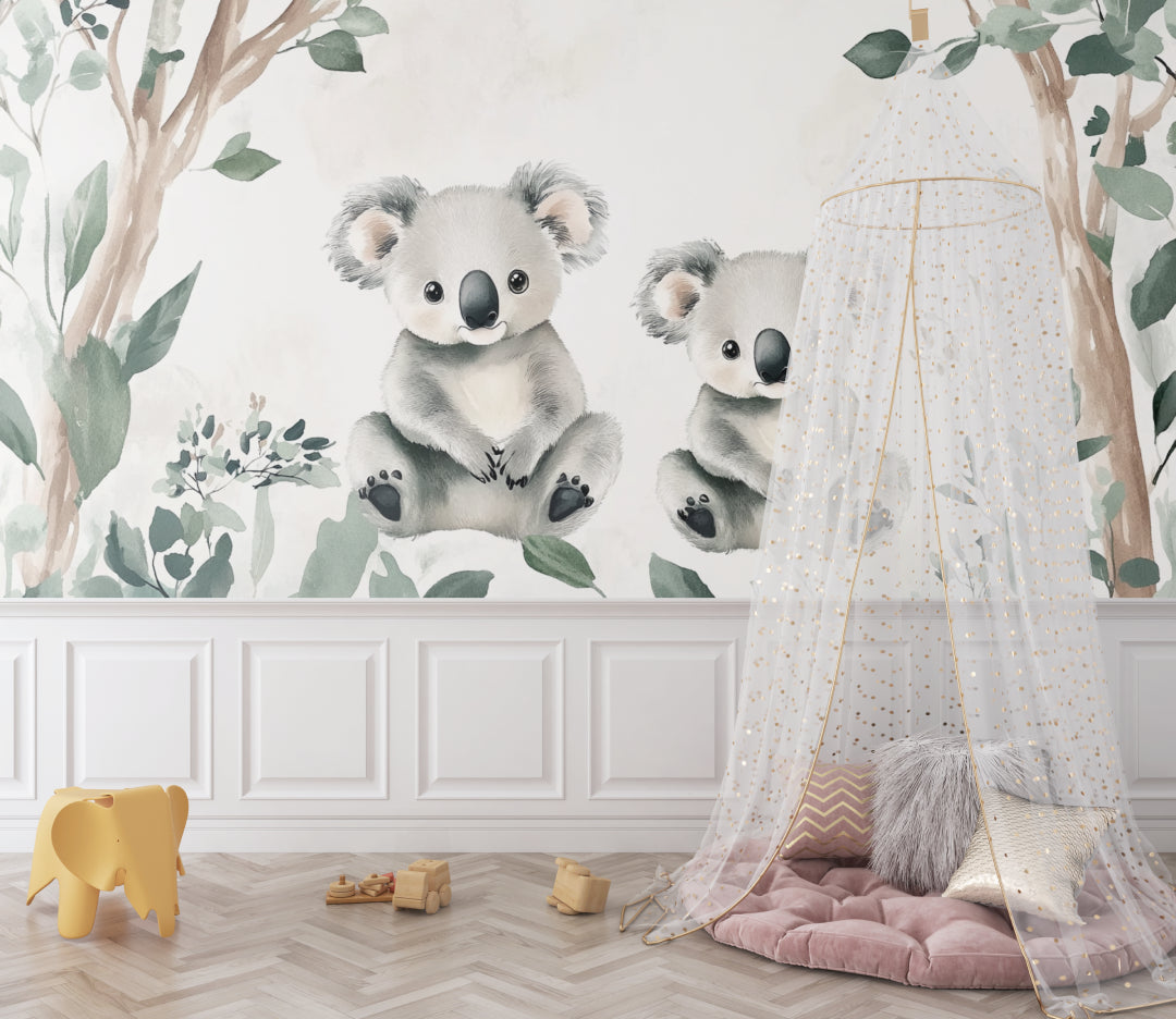Koala wallpaper mural in a bright nursery with white furniture