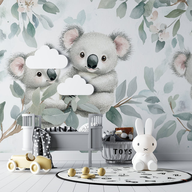 Koala nursery wallpaper creating a peaceful atmosphere in a modern baby room with white furniture