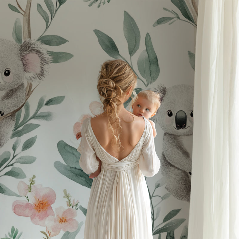 Koala wallpaper creating a peaceful atmosphere in a modern nursery with white furniture and natural light