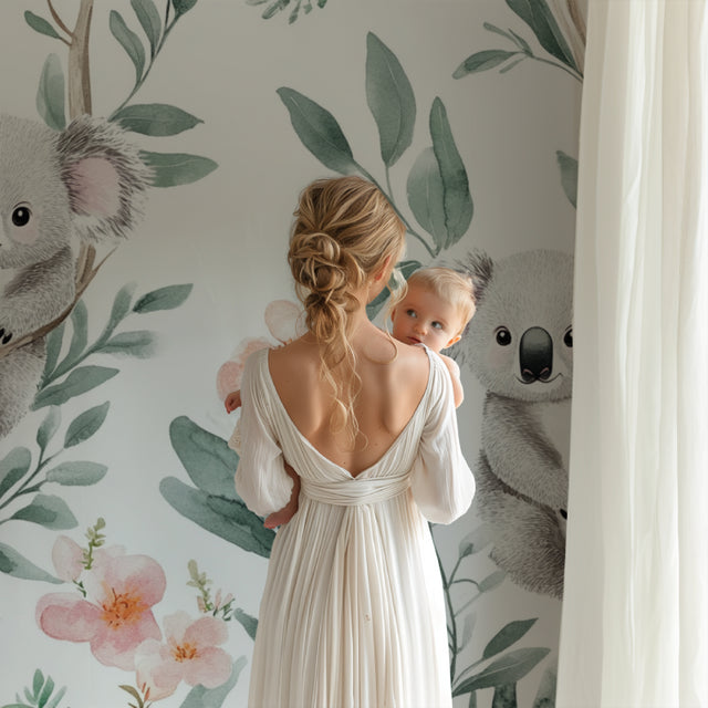 Koala wallpaper creating a peaceful atmosphere in a modern nursery with white furniture and natural light