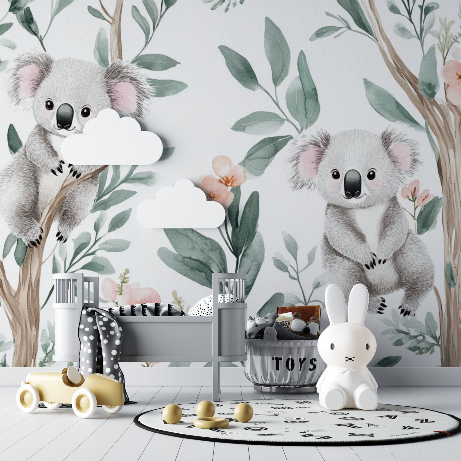 Sweet koala mural in a toddler's bedroom with wooden accents and soft pink details