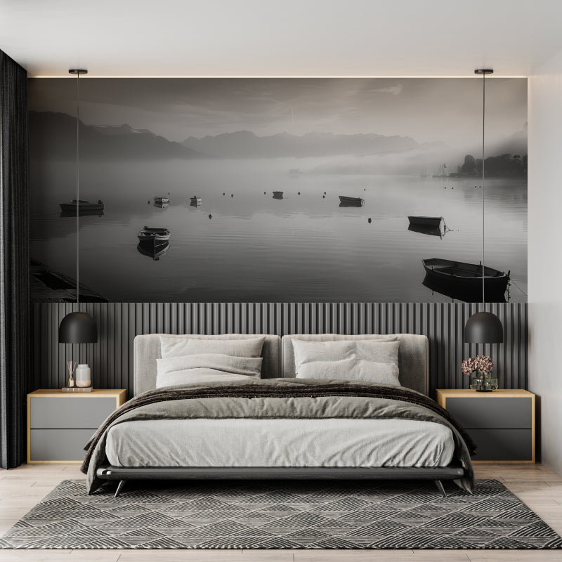 Black and white lake wallpaper creating a calm atmosphere in a modern living room with minimal furniture
