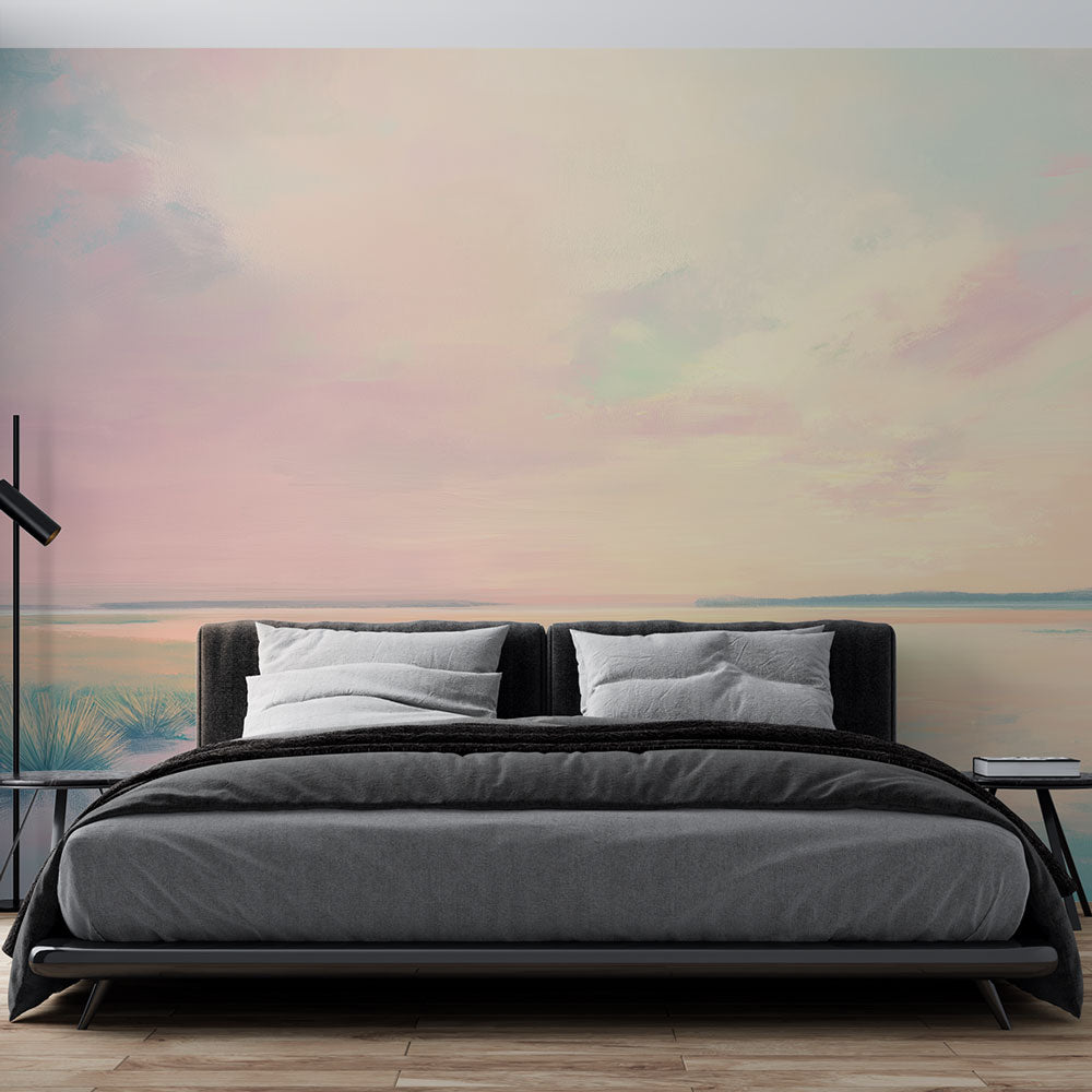 Lake sunset wallpaper mural creating a peaceful atmosphere in a modern bedroom with soft pastel colors and minimal furniture