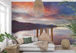 Lake landscape wallpaper creating depth in modern living room with minimal furniture