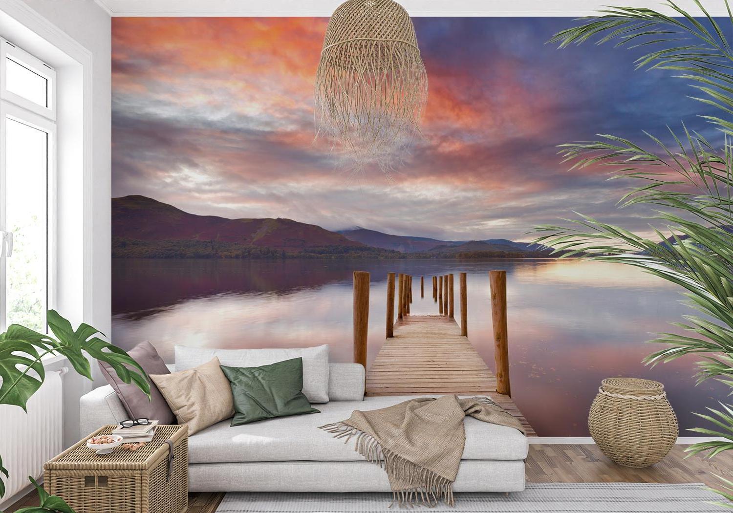 Lake landscape wallpaper creating depth in modern living room with minimal furniture