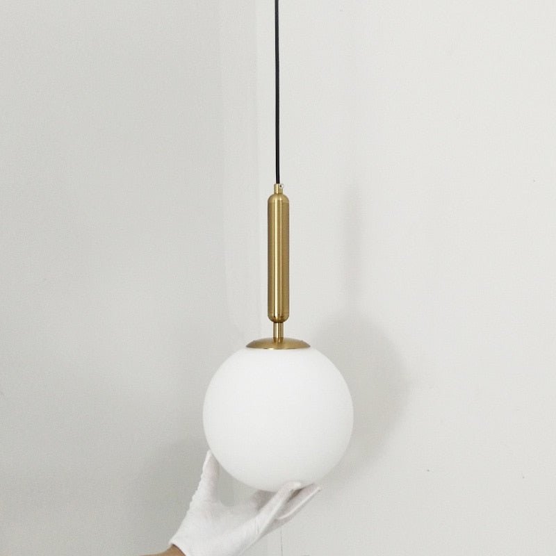 Modern Globe Pendant Light Brass Cylinder Design - Product example