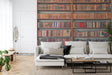 Library wallpaper mural creating a cozy reading nook in a modern living room corner