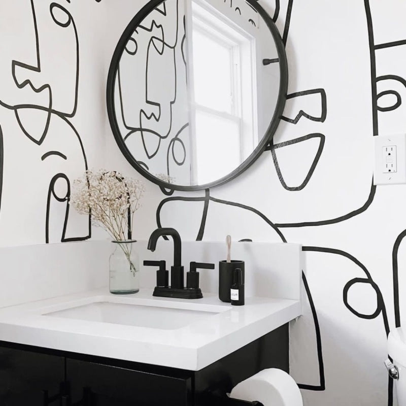 Abstract face wall mural bringing artistic flair to a modern home office setup