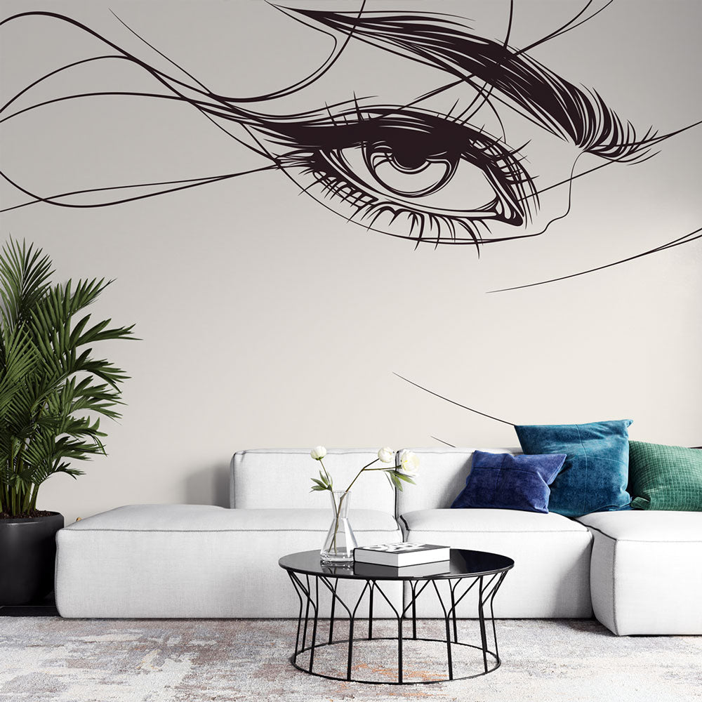 Line art eye sketch wallpaper creating dramatic focus in a modern minimalist living room with clean furniture lines
