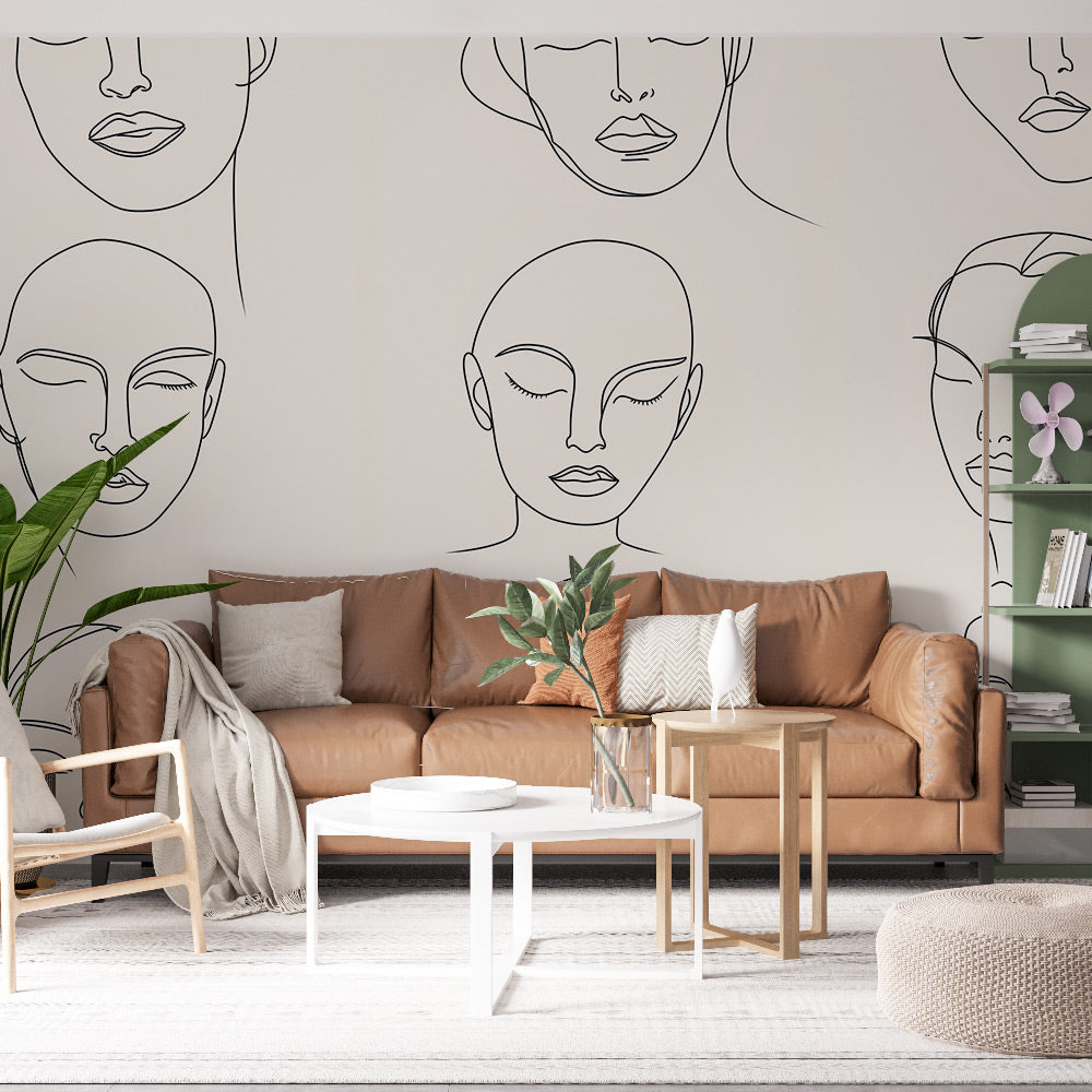 Line art face sketches wallpaper creating an artistic gallery wall in a modern living room with clean white furniture