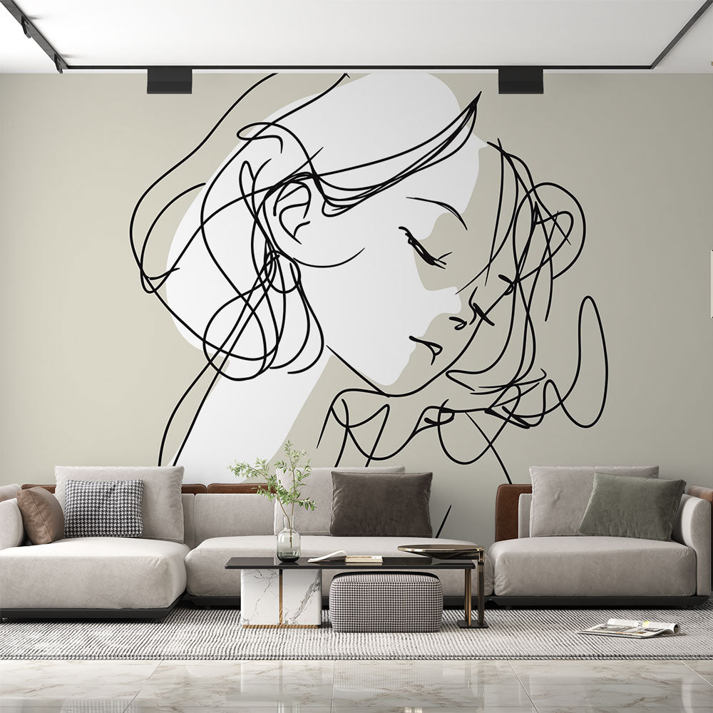 Line art portrait mural wallpaper creating a sophisticated atmosphere in a modern living room with minimal furniture
