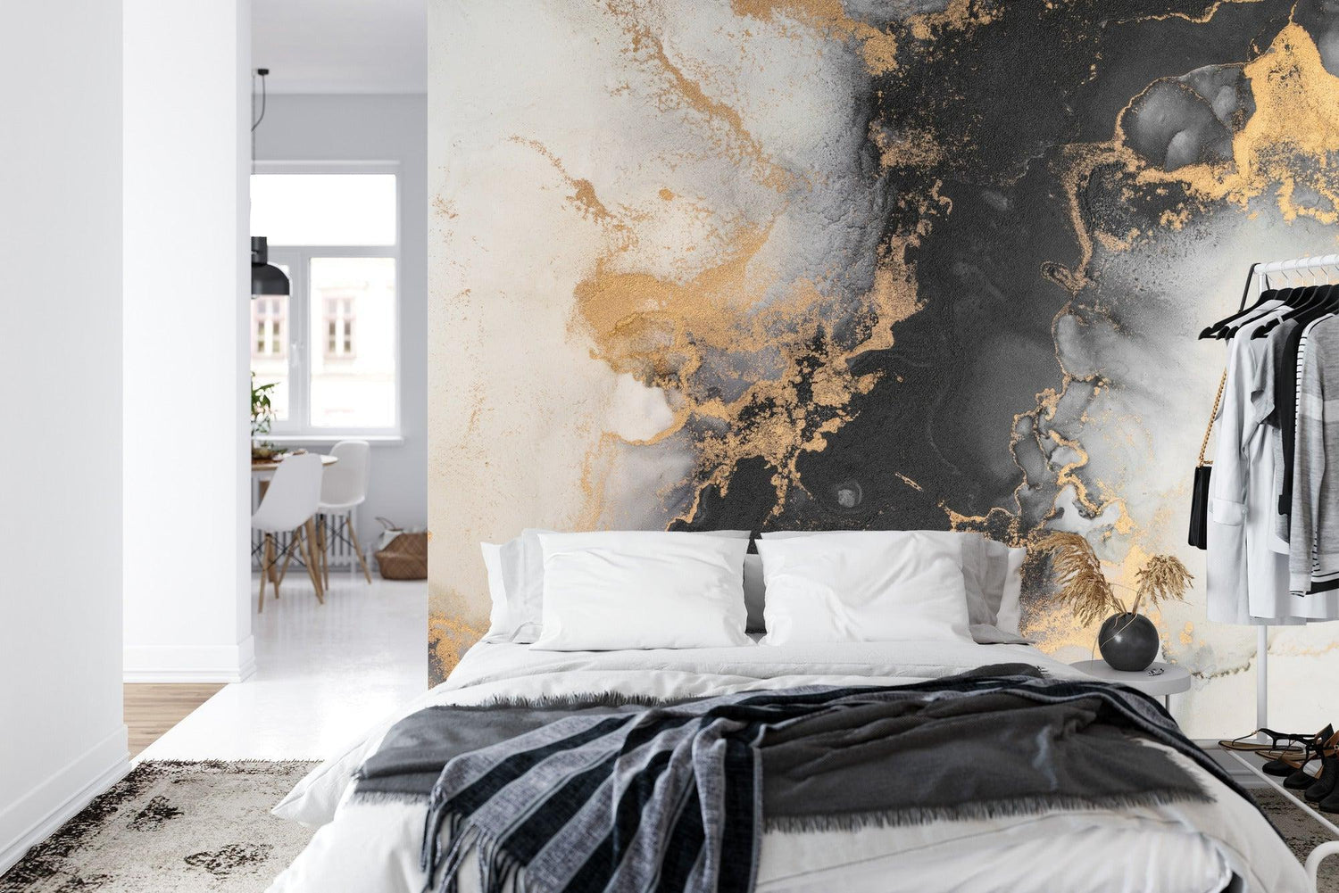 Abstract marble design transforming master bedroom with rich black and gold tones