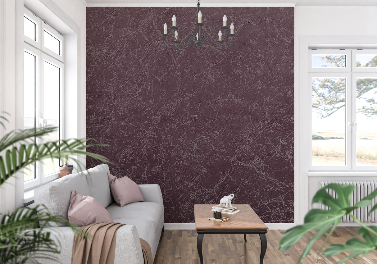 Burgundy marble wallpaper creating elegance in a modern dining room with crystal chandelier
