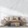 Marble wallpaper creating a luxurious accent wall in a modern living room with grey furniture