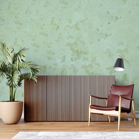 Sage green marble wallpaper in modern living room showing natural stone texture and soft lighting