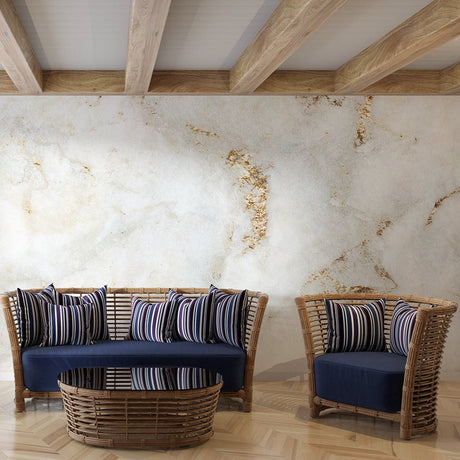 White and gold marble wallpaper in modern living room with high ceilings and natural light