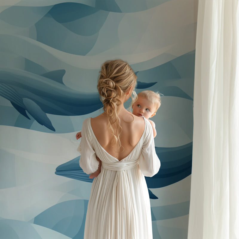 Whale mural wallpaper transforming a playroom with its calming blue tones and cloud designs