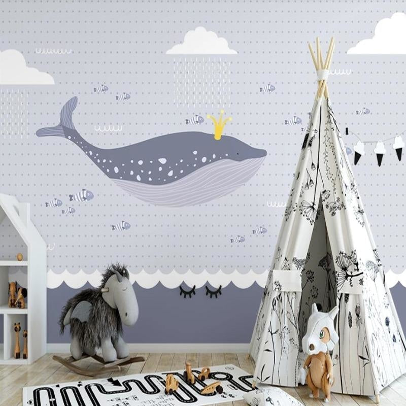 Marine animals wallpaper creating a dreamy atmosphere in a modern nursery with white furniture