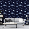 Marine life wallpaper creating a serene atmosphere in a modern living room, white sea creatures on navy blue background