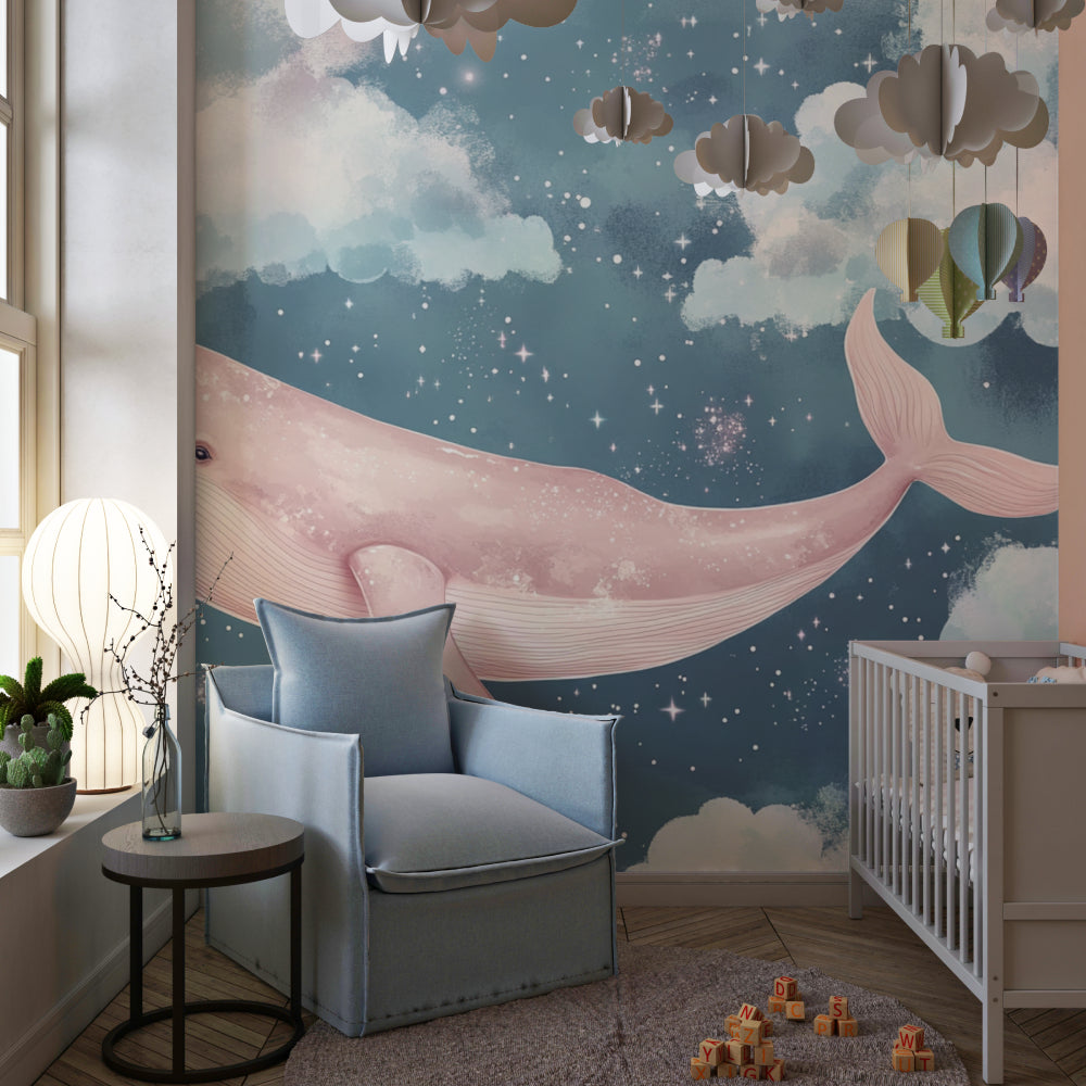 Pink whale wallpaper mural in a cozy nursery with a white crib and soft lighting