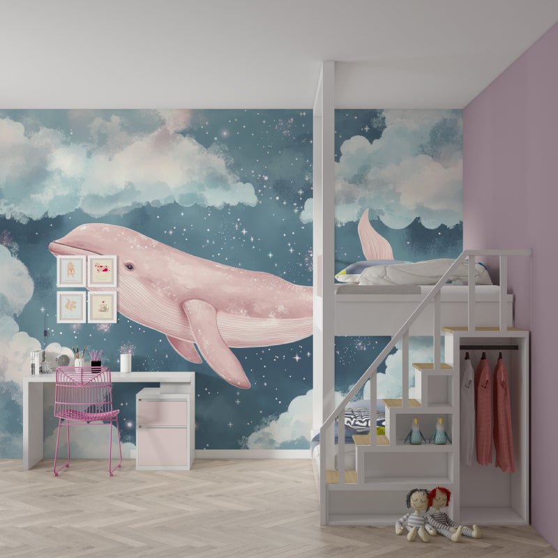 Celestial whale mural in a baby girl's nursery with pink accents