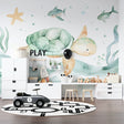 Marine animals wallpaper creating a soothing atmosphere in a modern nursery with mint green accents