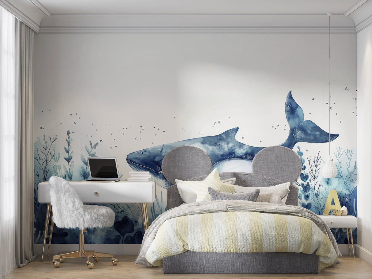 Watercolor whale wallpaper displayed in child's bedroom with calming ocean theme