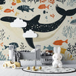 Marine animals wallpaper creating a dreamy underwater scene in a modern nursery with soft beige walls