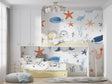 Marine animals wallpaper creating a cozy atmosphere in a modern nursery with white furniture