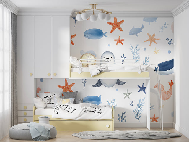 Marine animals wallpaper creating a cozy atmosphere in a modern nursery with white furniture