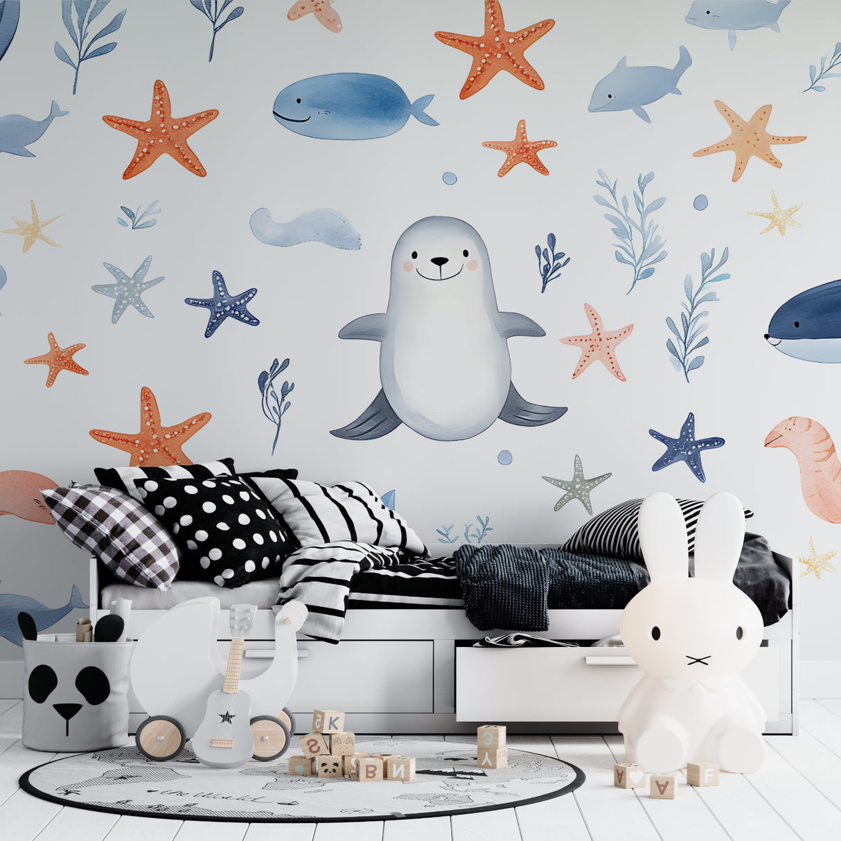 Whale wallpaper transforming a small bedroom into an underwater paradise